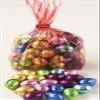 Scott's Cakes Foil-Wrapped Solid Chocolate Eggs in a 1 Pound Red Stripes Bag view 1