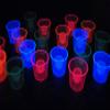 DIRECTGLOW LLC 4oz 20ct Assorted Blacklight Reactive Soft Plastic Bomber Shot Glasses view 2