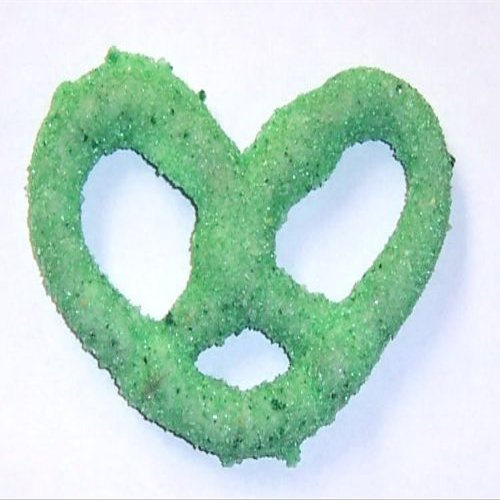 Scott's Cakes White Chocolate Covered Pretzels with Green and Lite Green Sugar in a 1 Pound Plastic Deli Container