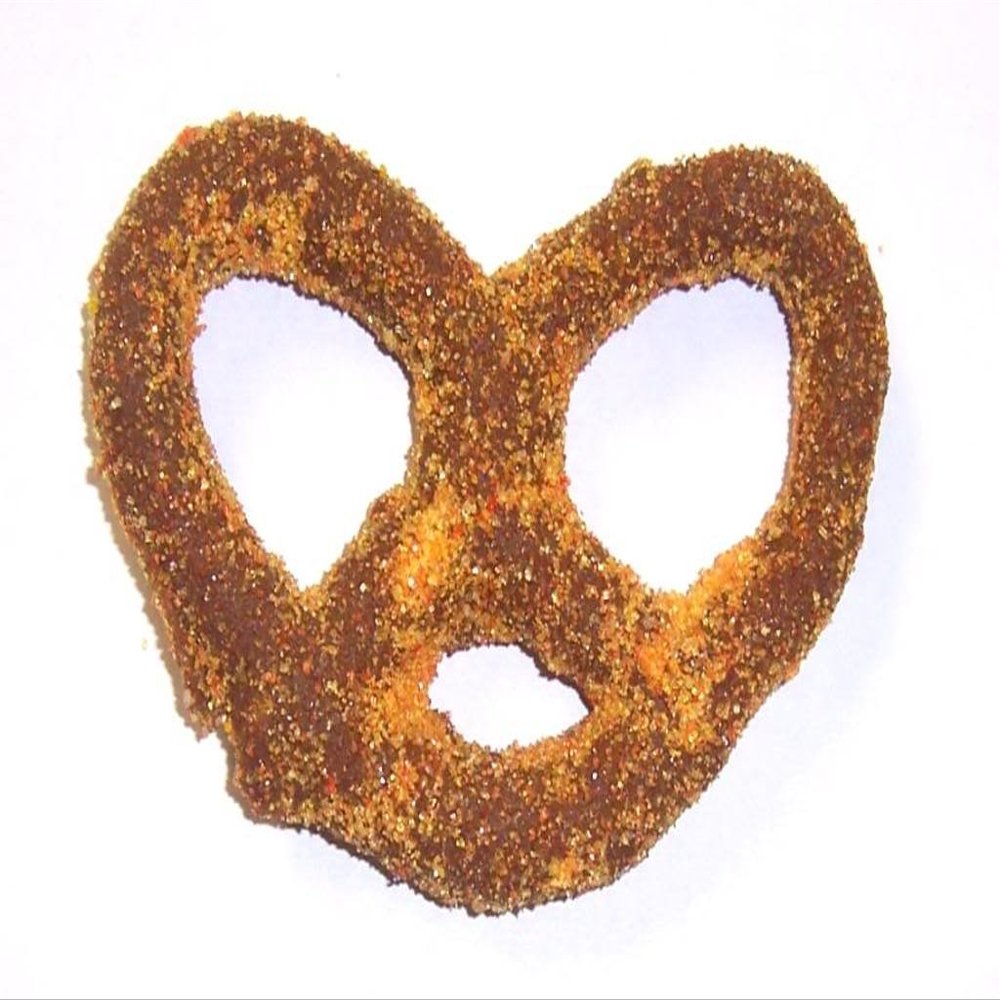 Scott's Cakes Milk Chocolate Covered Pretzels with Yellow and Orange Sugar in a 1 Pound Clear Cello Bag