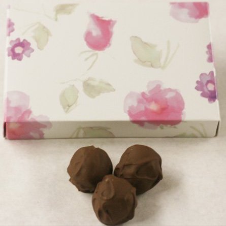 Scott's Cakes Milk Chocolate Covered Hazelnut Praline Truffles in a 1 Pound Pastel Flower Box
