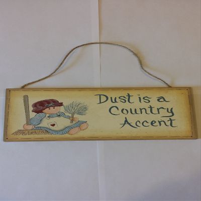 Antique Rustic Wooden "Dust is a Country Accent" Sign painted antique white with a rag doll holding a feather duster and a broom. Measures 9-3/4 x 4-3/4 x 1/4" with a rope hanger.