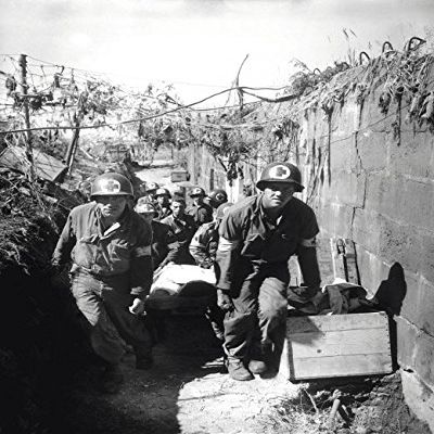 Medics remove a casualty from the battle field to an aid station Poster Print by Stocktrek Images (22 x 34)