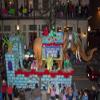Costumed men ride on elephants back Mardi Gras began in Mobile Alabama in 1703 when it was a colony of French soldiers Colorful beads and Moon Pies (two large cookies with marshmallow in between and c view 1