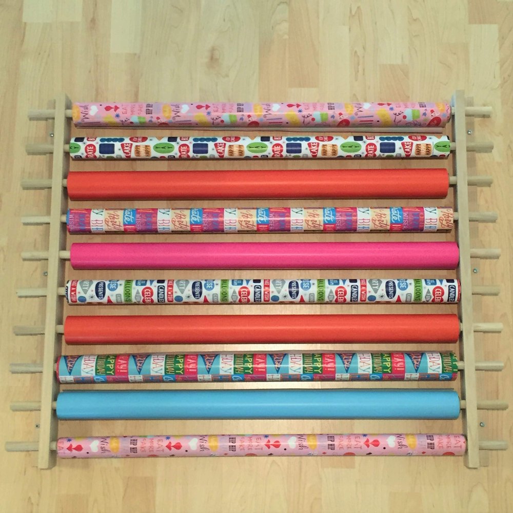 Z-Things Storage, Organizer, Dispensing Rack for Gift Wrapping Paper, Ribbons, Cellophane, Vinyl Rolls, Paper, Maps Etc. Holds 10 Rows. Adjustable Width. Easy Wall Mount. Hardware Included.