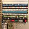 Z-Things Storage, Organizer, Dispensing Rack for Gift Wrapping Paper, Ribbons, Cellophane, Vinyl Rolls, Paper, Maps Etc. Holds 10 Rows. Adjustable Width. Easy Wall Mount. Hardware Included. view 4
