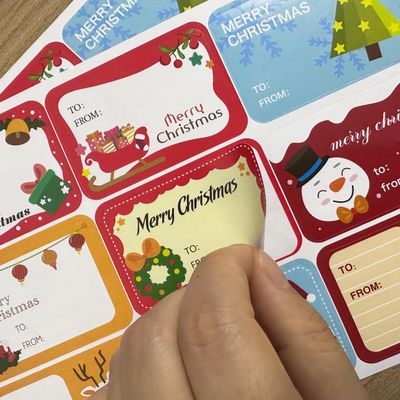 108 Count Christmas Gift Tags - Self Adhesive Holiday Stickers with 54 Unique Festive Designs for Wrapping Presents - Fun Xmas Labels for Gifts and Holiday Decorations