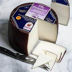 igourmet Drunken Goat Spanish Cheese and Cheese Storage Bag - Whole Wheel (4.5 pound) - Drunken Goat Cheese is mild and smooth, not goaty, with a touch of fruitiness in the finish
