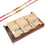 Jaiccha Ghasitaram Rakhi Gifts for Brothers - Set of 2 Striped Wooden Trays of Sugarfree Bites, Almonds and Walnuts with 2 Pearl Rakhis view 1
