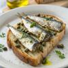 King Oscar Premium Sardines in Extra Virgin Olive Oil with White Wine Vinegar & Capers, 3.75-Ounce Cans (Pack of 12), Wild Caught Sardines view 4