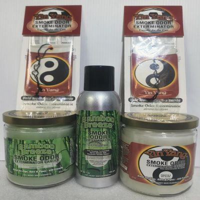 Smoke odor Exterminator Bamboo Breeze, Includes Two 13 oz Jar Candle One 7 oz Spray & Two Car Hangers All in One Bundle.
