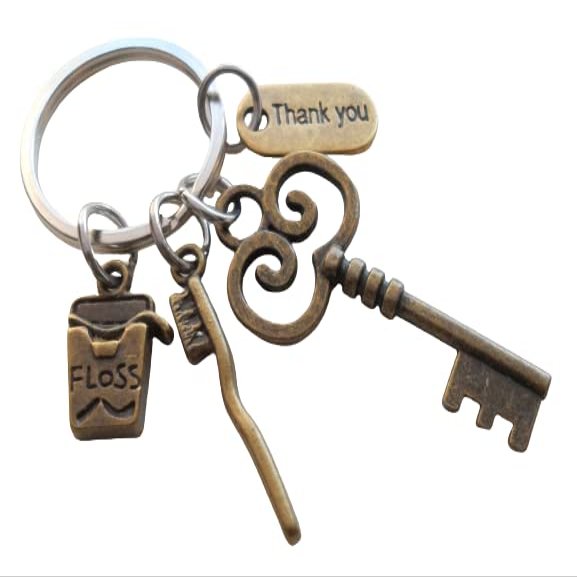 JewelryEveryday Dental Assistant, Dental Office Staff, Orthodontics Employee Thank You Keychain; Bronze Toothbrush, Floss & Key Charm Keychain