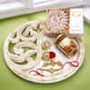 Ghasitaram Gifts Rakhi Gifts for Brothers White Wooden Thali with Mix Dryfruits, Kaju Katlis and Bhaiya Bhabhi Rakhis view 1