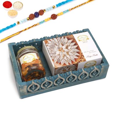 Ghasitaram Gifts Rakhi Gifts for Brothers Blue Wooden Tray with Kaju Katlis and Mix Dryfruits Jar with 2 Blue Rudraksh Rakhis