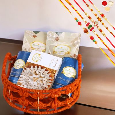 Ghasitaram Gifts Rakhi Gifts for Brothers Orange Jute Basket of assortments with Kaju Katli with 5 rakhis