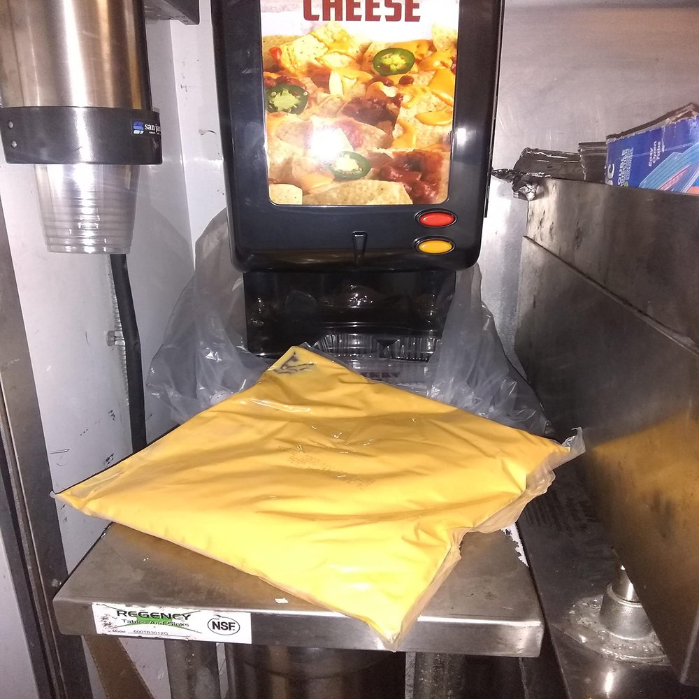 Carnival King 110 oz. Cheddar Cheese Sauce Bag - 4/Case