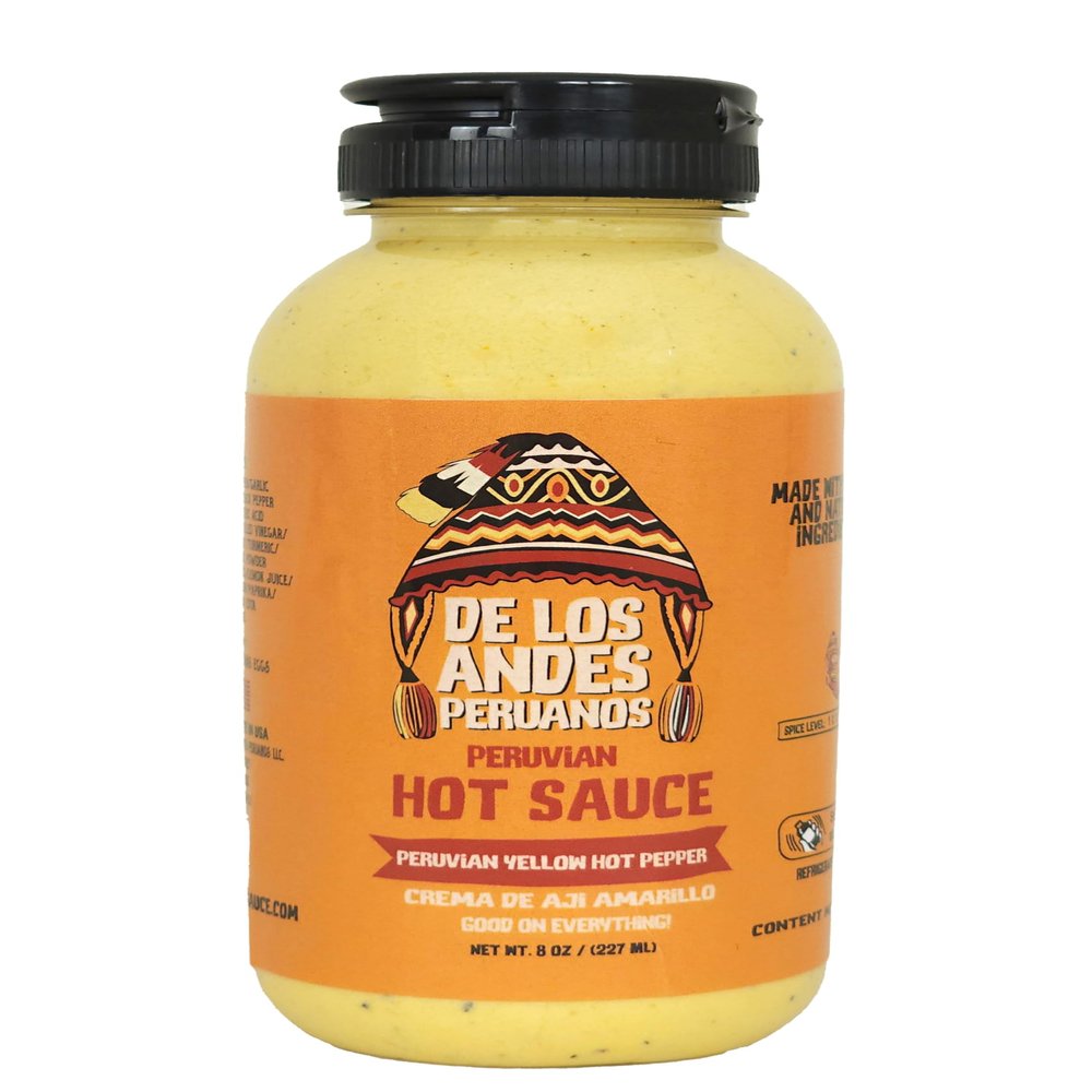 Aji de los Andes Peruanos Crema de Aj Amarillo 8.0 oz "Elevate your meals with the authentic taste of our Peruvian Yellow Hot Pepper Sauce. Crafted from handpicked Peruvian yellow hot peppers, our small-batch process ensures unmatched flavor and fre