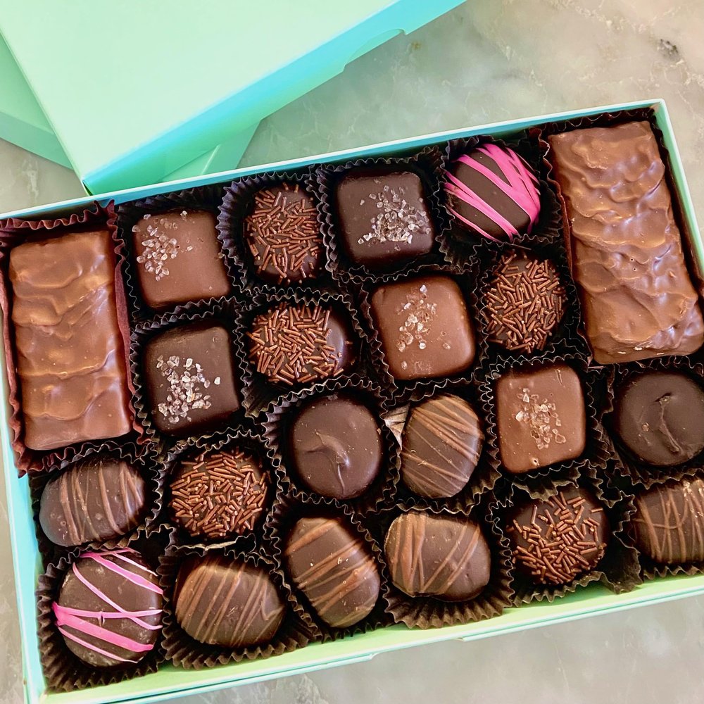 1 lb of gourmet assorted chocolate candies. A milk and dark chocolate fancy candy gift box of english toffee, chocolate covered cherries, soft center creams, and sea salt caramel chews