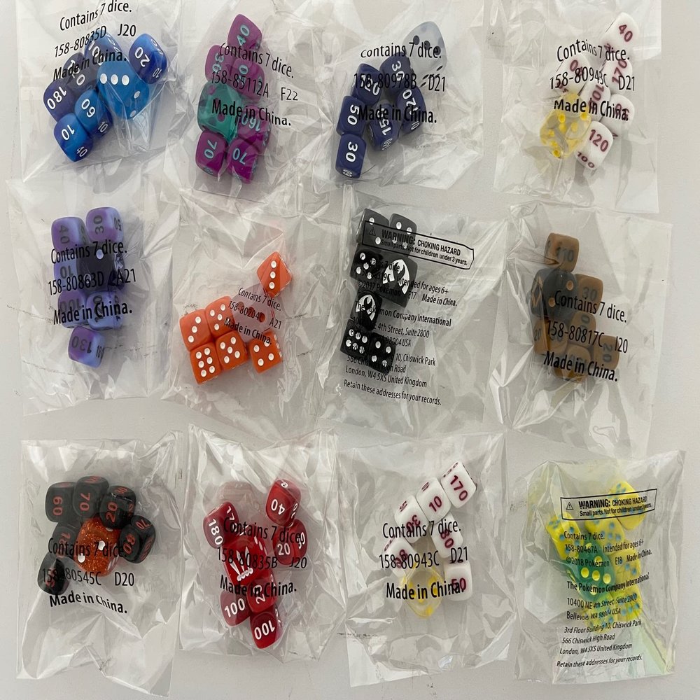 Random Collection of 49 dice in Cello Factory Sealed Packs of 7 from Different Elite Trainer Boxes