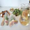 12 Organic 5 gram Fig Tea Bags with dried leaves and sliced fruit in a Resealable Bag view 1