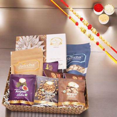 Ghasitaram Gifts Jaiccha Rakhi Gifts for Brothers - Brown Medium Tray of 9 Goodies with Kaju katli with 2 Rakhis