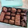 Nuts and chews gourmet candy box. 1 lb candy box of dark and milk chocolate candies with assorted clusters of nuts, pecan crunch bars, caramels, and nougats. view 1