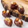 Premium Medjool dates are stuffed with nuts (Pistachios, Almonds, Cashews, Biscuits, and Orange peel) and filled with nuts paste., Meduim view 2