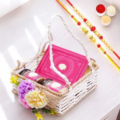 Ghasitaram Gifts Jaiccha Rakhi Gifts for Brothers Jute Square Flower Basket with Kaju Katli and 2 Jars of Crunchy Cashews and Flavour Raisins with 2 rakhis