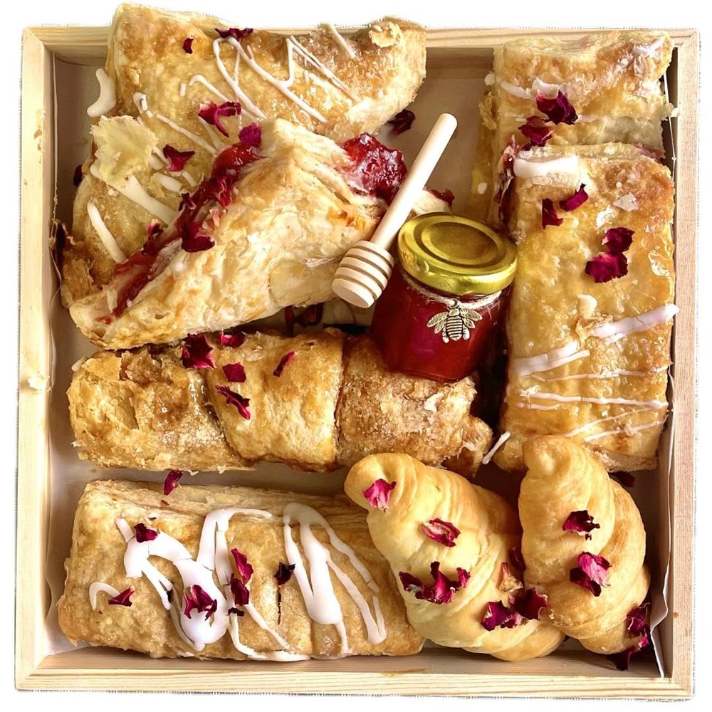 Baked Croissants & Pastry Charcuterie Board with guava, cherry, and pineapple pastries