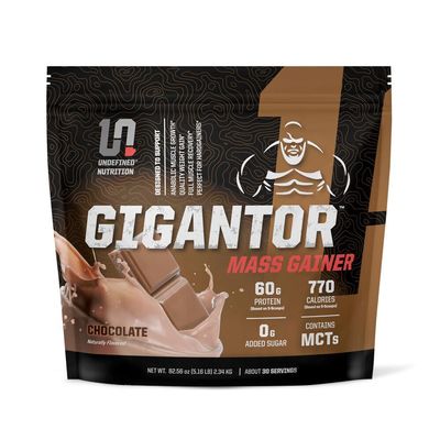 Undefined Nutrition Gigantor Mass Gainer by Brian Shaw (60g Protein, 30 Servings, up to 790 Quality Calories)  Hardcore Hard Gainer Formula with 5- Phase Protein Blend (5.16 lbs, Chocolate)