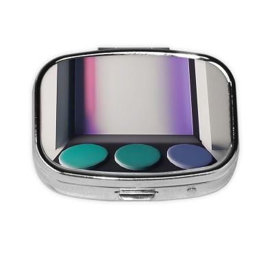 A dim Color Palette Travel-Friendly Pill Box - Portable Square Organizer with Compartments for Medicines, Vitamins, and Supplements, Durable Metal Design.