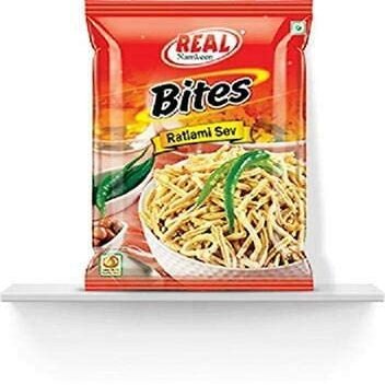 Real Namkeen Ratlami Sev, Traditional Indian Snack.Real Namkeen Bites Ratlami Sev offers a bold and spicy burst of traditional Ratlami flavors in every crispy bite.