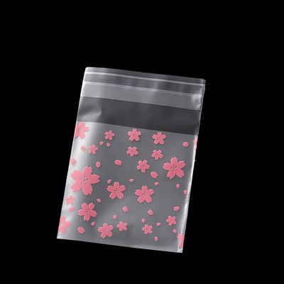 100pcs Clear Self-Sealing Plastic Bags for Candy, Cookies, Jewelry Packaging - Ideal for Weddings and Birthday Parties - (Color: Flower/Size: 10X10Cm)
