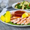 Shrimp Tray with Cocktail Sauce, Shrimp and zesty cocktail sauce in a party ready tray,Its accompanied by fresh lemon wedges, adding a tangy twist to the dish. 1.5 POUND view 4