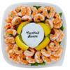 Shrimp Tray with Cocktail Sauce, Shrimp and zesty cocktail sauce in a party ready tray,Its accompanied by fresh lemon wedges, adding a tangy twist to the dish. 1.5 POUND view 1