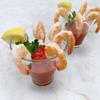 Shrimp Tray with Cocktail Sauce, Shrimp and zesty cocktail sauce in a party ready tray,Its accompanied by fresh lemon wedges, adding a tangy twist to the dish. 1.5 POUND view 4