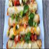 Chicken and Cheese Taquitos , Frozen , Grilled and seasoning in a crispy flour tortilla , Tasty grilled chicken is combined with real Monterey Jack cheese, onions, peppers and authentic seasonings and wrapped inside a crispy oven-baked flour tortilla view 4