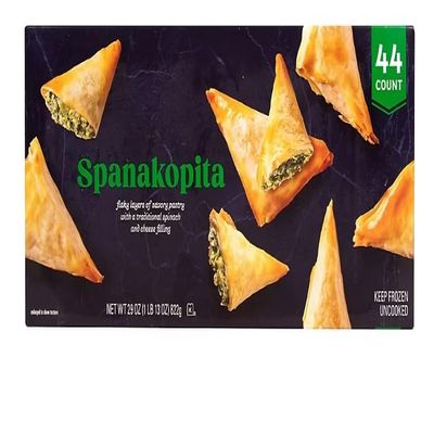 Spanakopita, a beloved Greek pastry that delights the senses with its layers of flaky phyllo dough and savory spinach filling. Crafted with care, each bite of this Spanakopita delivers a symphony of flavors and textures. The Spanakopita features a lu