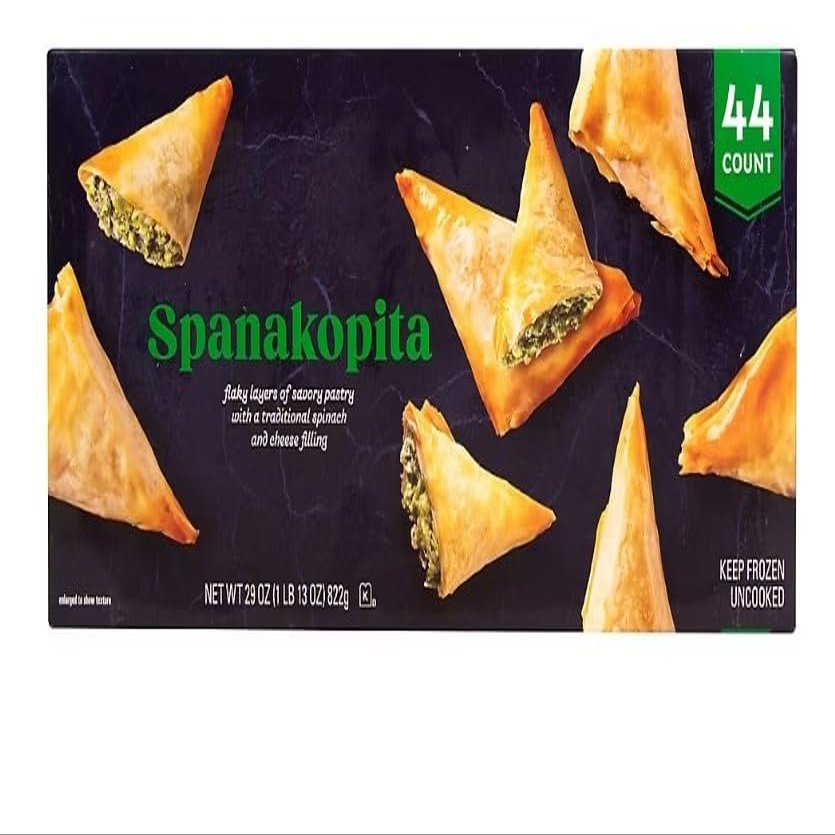Spanakopita, a beloved Greek pastry that delights the senses with its layers of flaky phyllo dough and savory spinach filling. Crafted with care, each bite of this Spanakopita delivers a symphony of flavors and textures. The Spanakopita features a lu