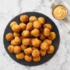 Mac and Cheese Bites , Cavatappi pasta and a creamy, three-cheese filling coated in panko bread crumbs. Crispy on the outside, creamy on the inside, this classic comfort food gets reimagined as a bite-sized appetizer. Warning: guests gobble these up view 4
