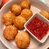 Taste of Italy Cheese Pizza Arancini with Marinara Sauce , also called Italian rice balls, are made with Arborio rice and stuffed with marinara sauce, and a blend of mozzarella and provolone cheese for a pull of melted cheese, coated in Italian bread view 2