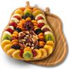 A Gift Inside Festive Dried Fruit and Nuts on Bamboo Pear Shaped Cutting Board view 1