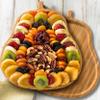 A Gift Inside Festive Dried Fruit and Nuts on Bamboo Pear Shaped Cutting Board view 2